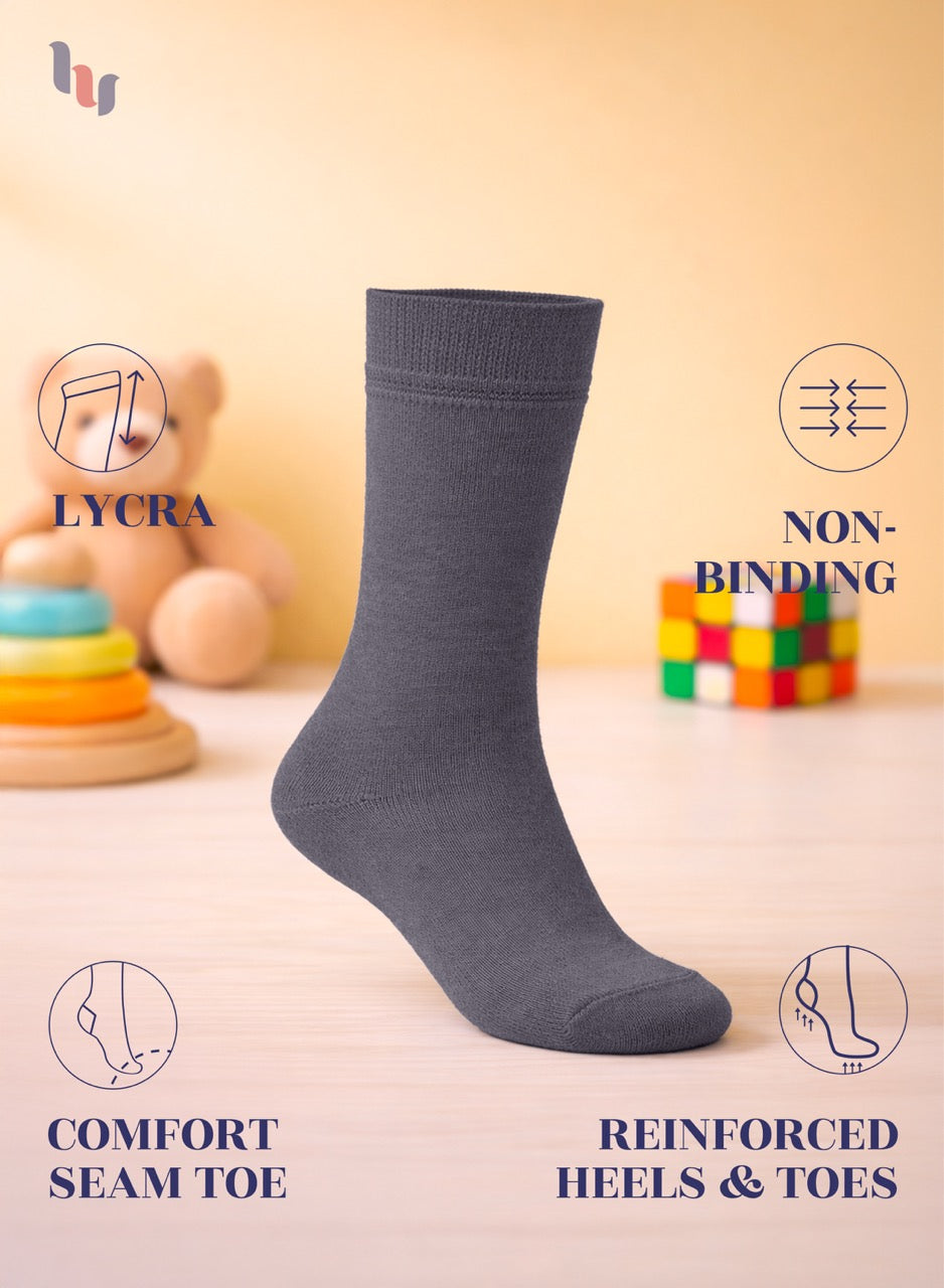 Gray sock with features highlighted on a blurred background with toys
