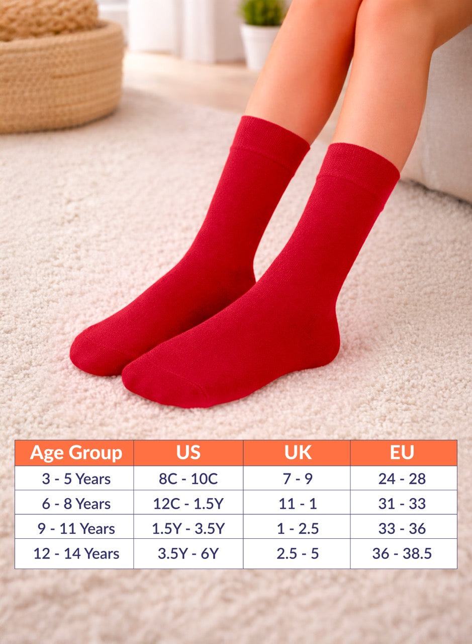 Red socks on feet with size chart for children's ages 3 to 14 on a light background