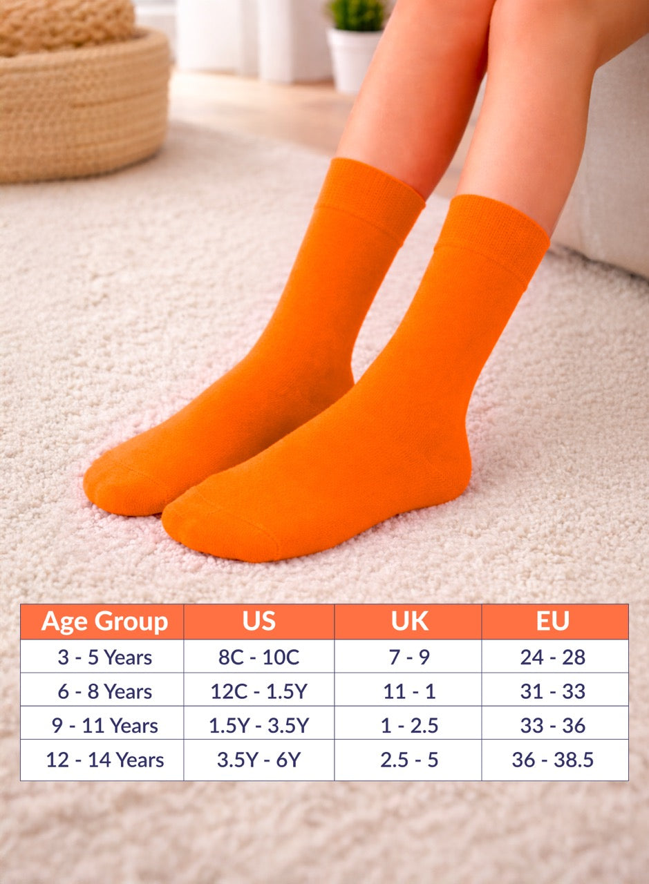 Pumpkin orange socks on feet with size chart for children's ages