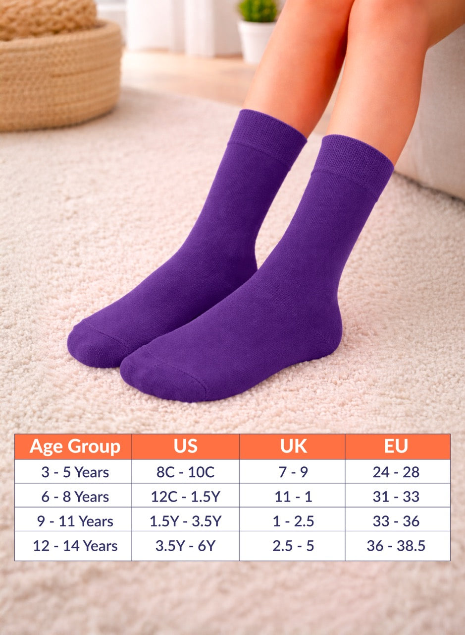 Purple socks on feet with size chart below on a light background
