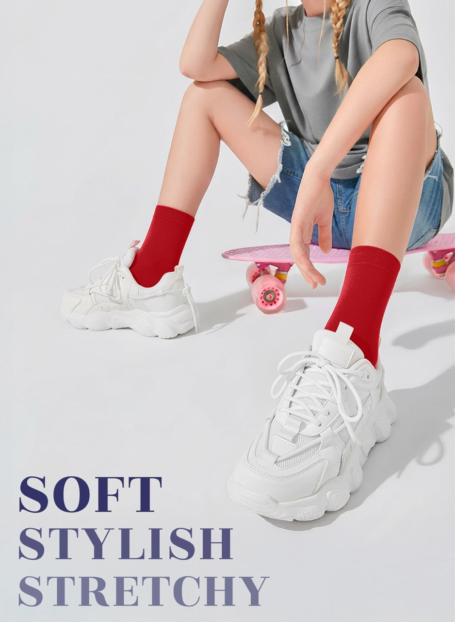 Person wearing white sneakers with text 'SOFT STYLISH STRETCHY' on a light gray background