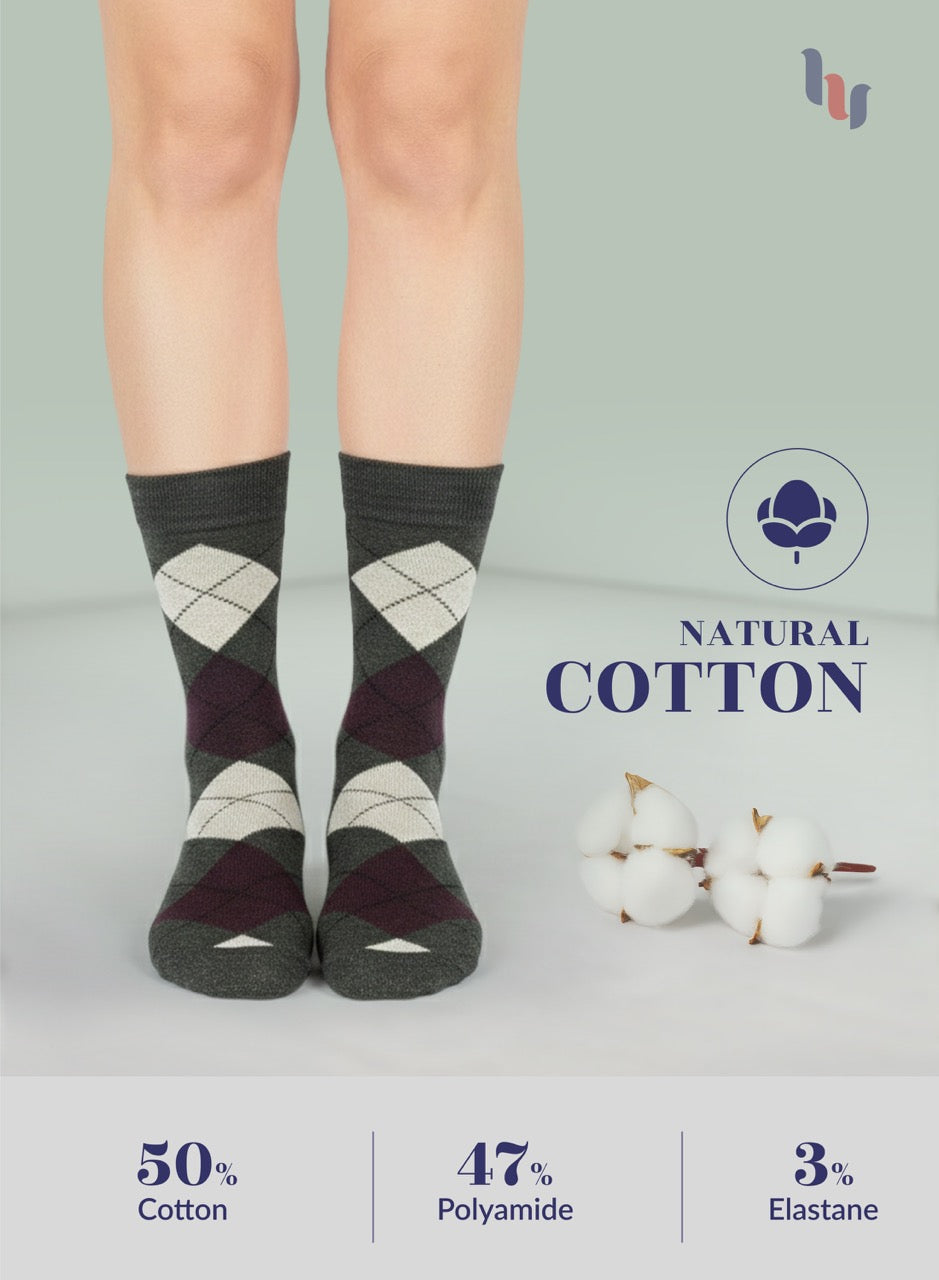 Pair of dark army green argyle socks with natural cotton label and fiber content details on a light gray background.