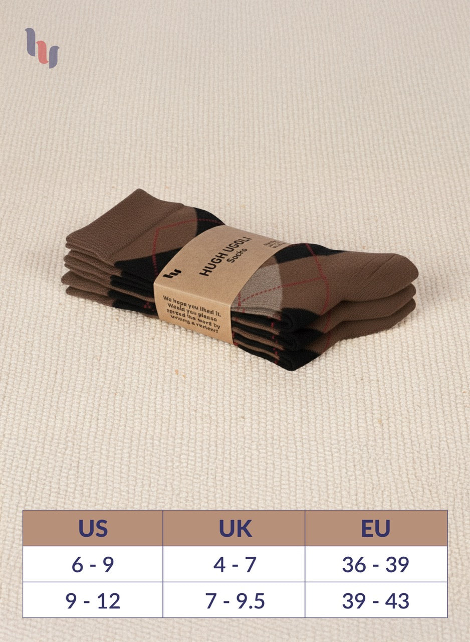 Pack of brown brown socks with a label on a beige fabric background, featuring a size chart below.