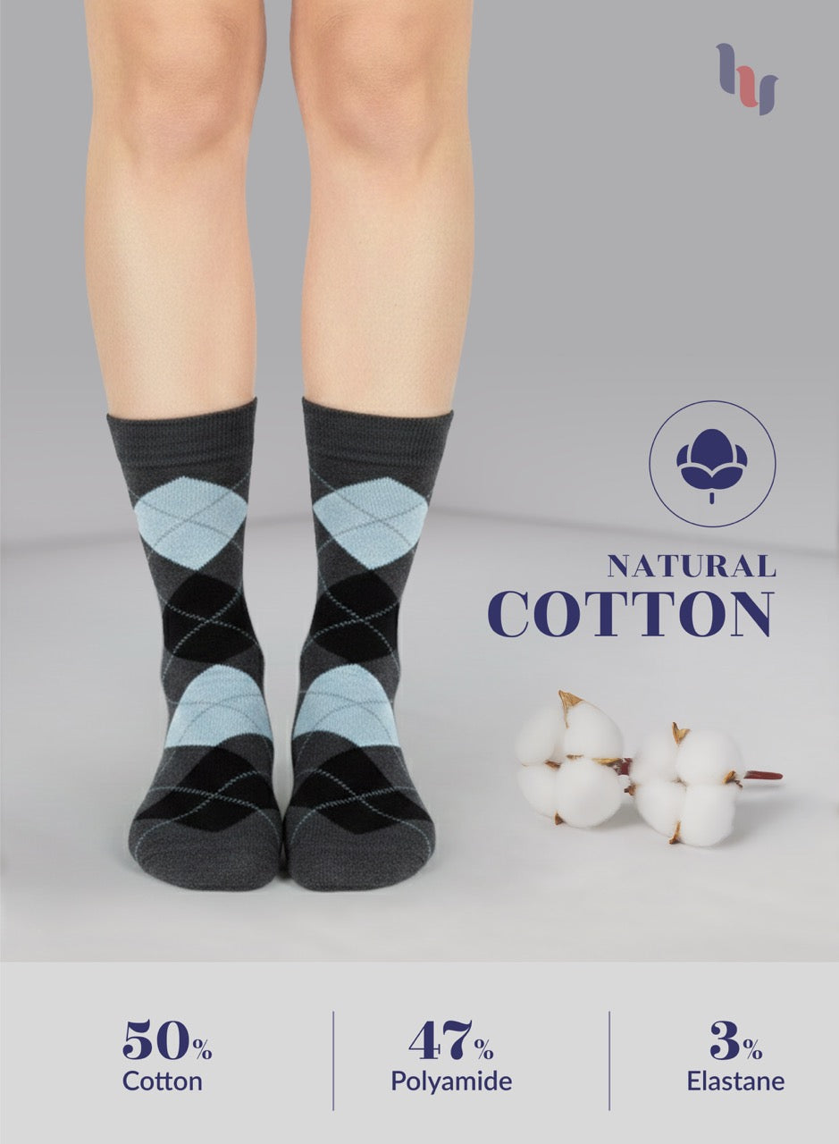 dark grey argyle socks worn by a person, with natural cotton label and fiber content details.