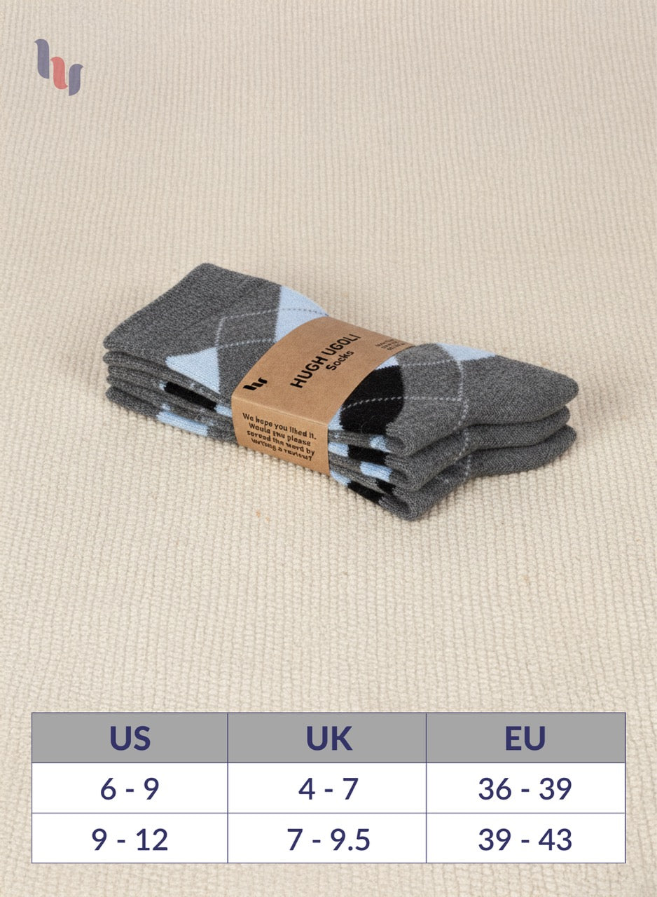 Pack of dark grey socks with a size chart on a beige background