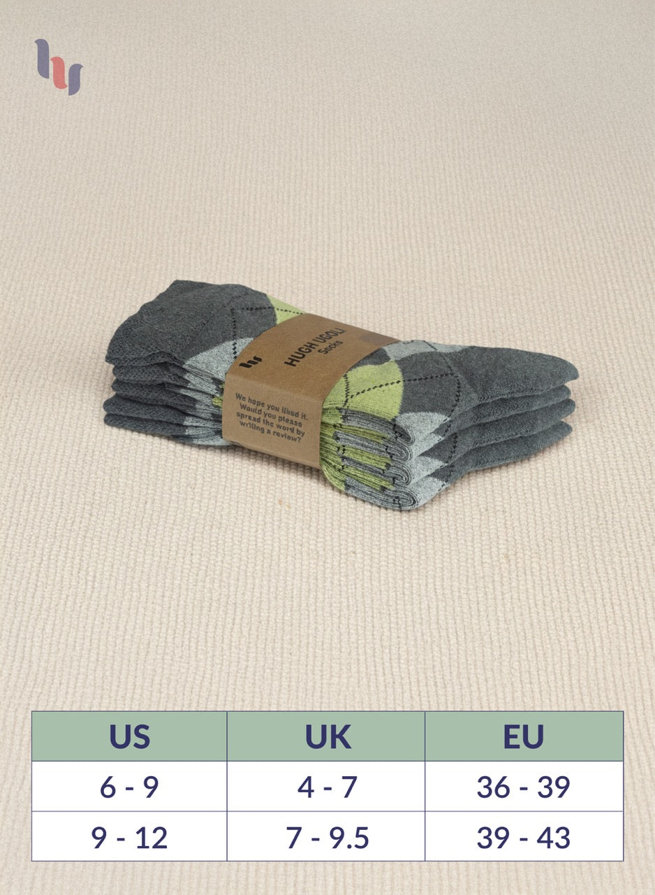 Pack of grey socks with a size chart on a beige background