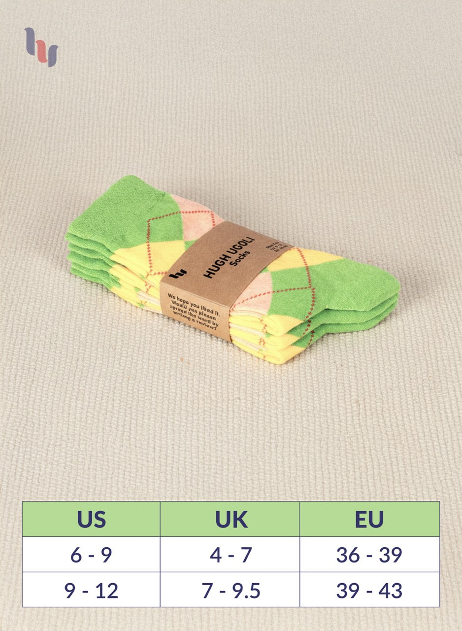 Pack of colorful Green socks with a size chart on a beige fabric background