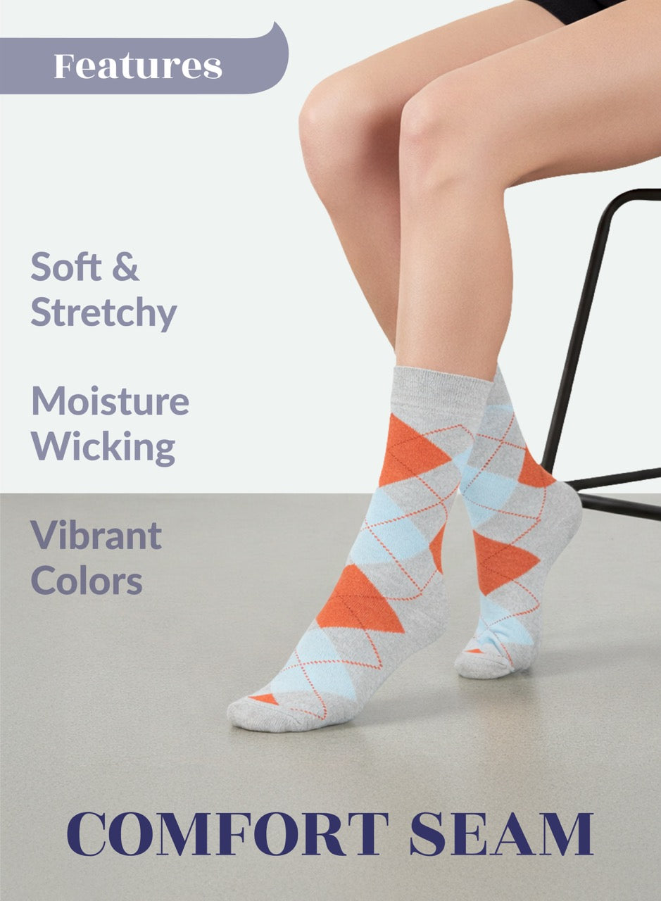 Person wearing Light Grey socks with orange triangles on a light background, featuring text about sock features.