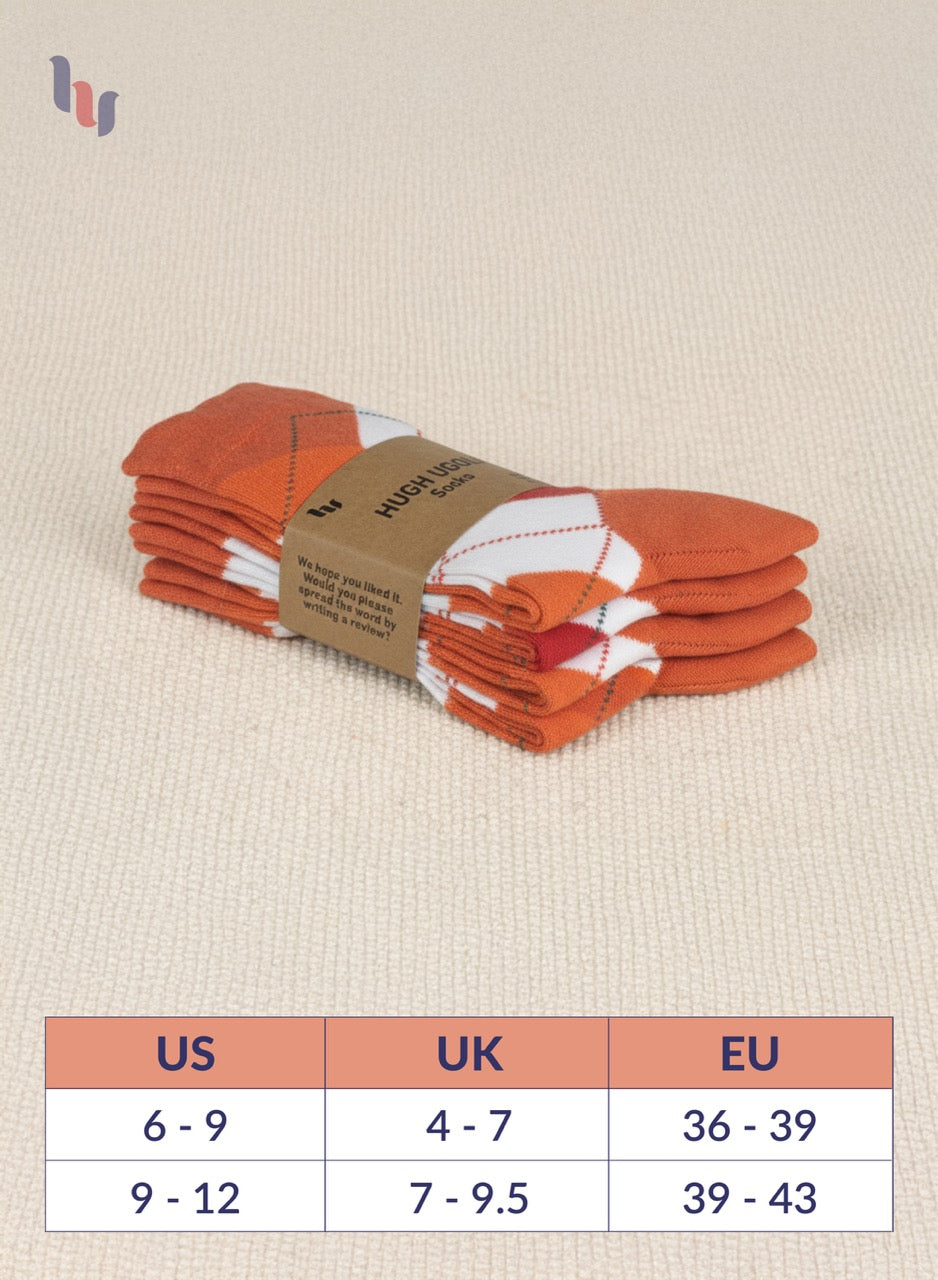 Stack of orange socks with a size chart on a beige background