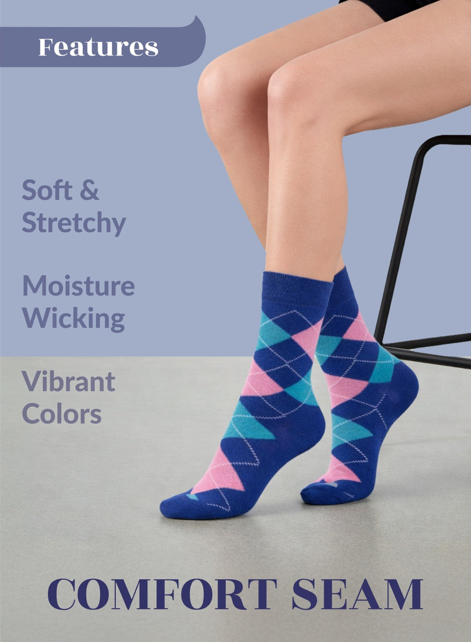 Person wearing parliament argyle socks with pink and green accents on a light gray floor.