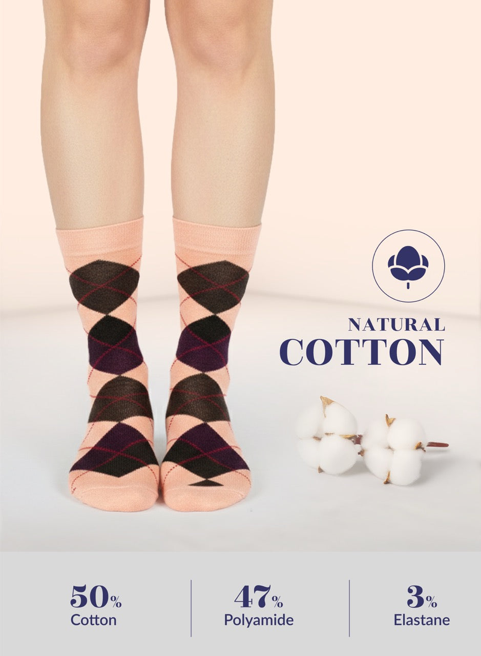 Peach Patterned socks with natural cotton label and ingredient information on a light background