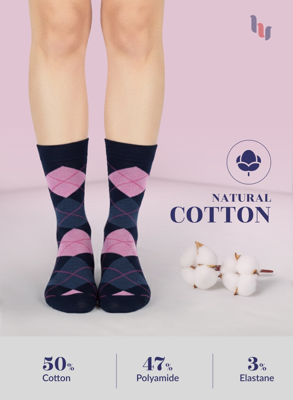 Pair of argyle pattern socks with pink and navy blue worn by a person, on a light pink background with cotton and brand logo.