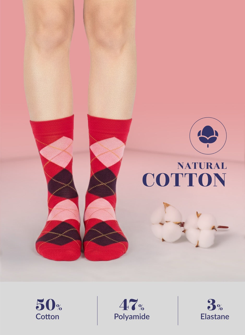 Red argyle socks worn by a person on a pink background with cotton graphics and text.