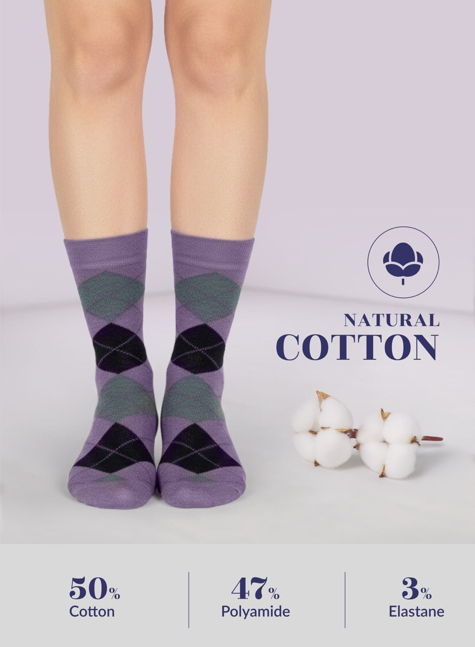 Violet argyle socks worn by a person on a light gray background with 'Natural Cotton' label and cotton fibers.