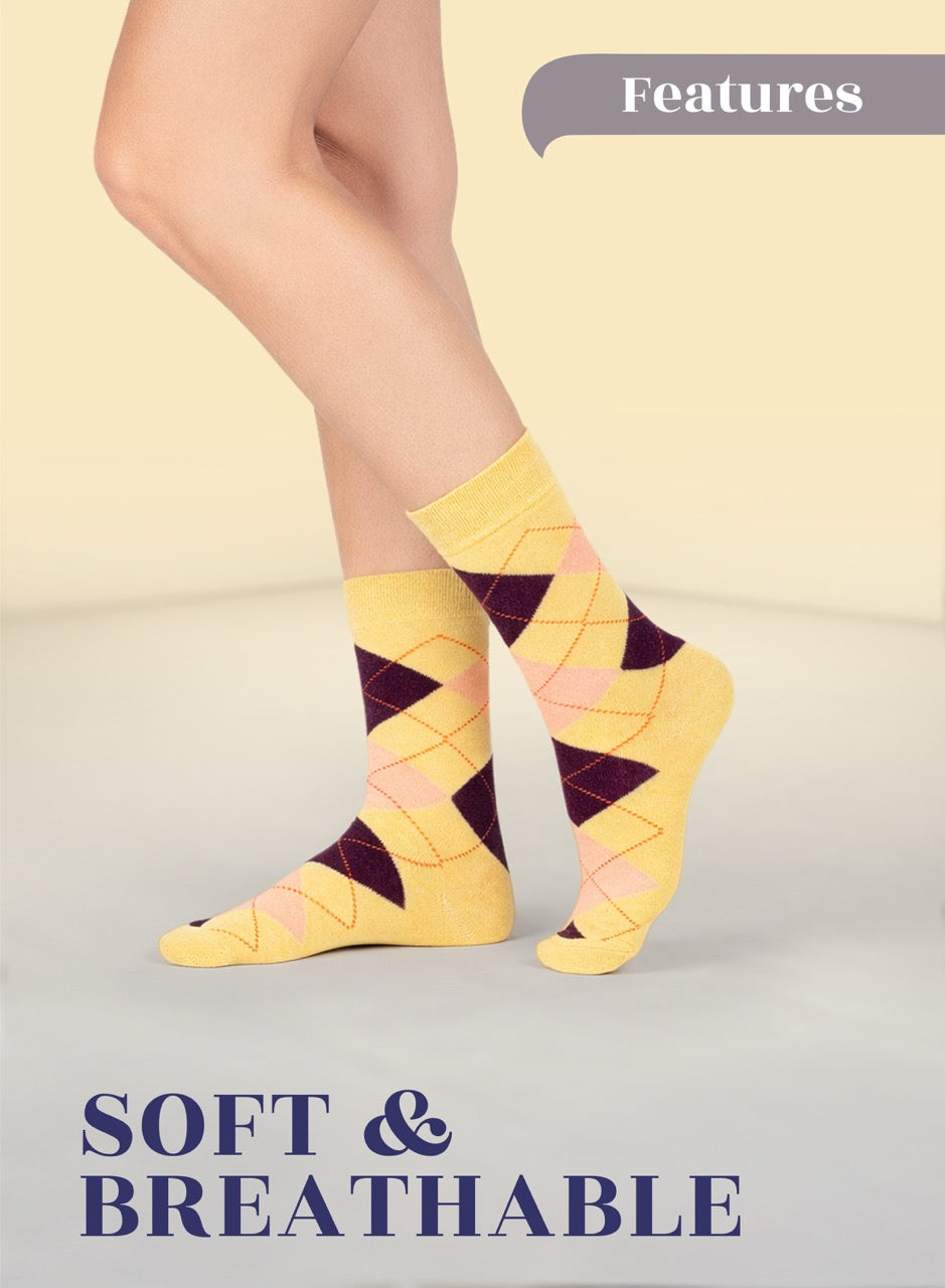 Yellow argyle socks worn by a person on a light gray background with 'Features' and 'SOFT & BREATHABLE' text.