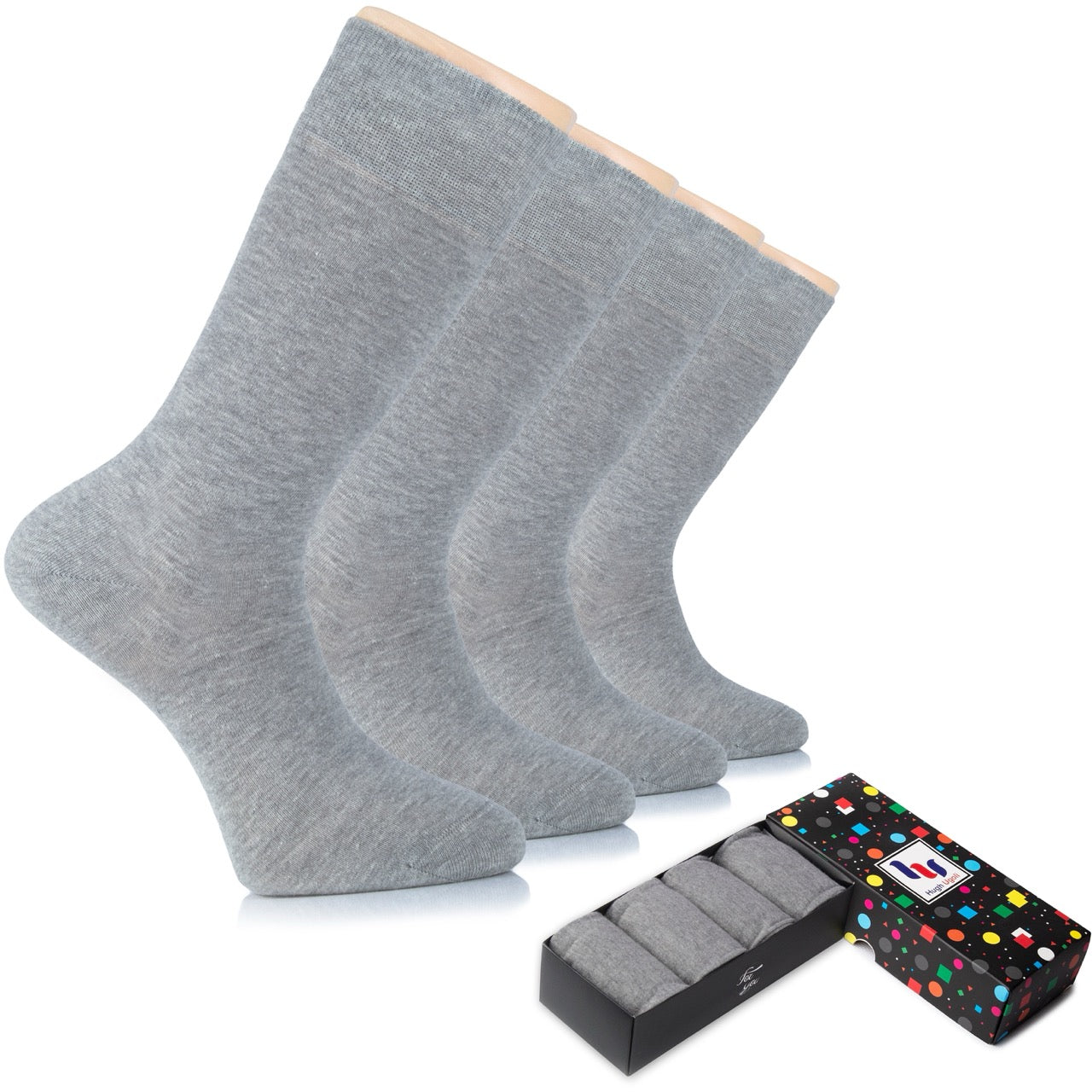 Three pairs of light gray socks with a black box and colorful packaging on a white background