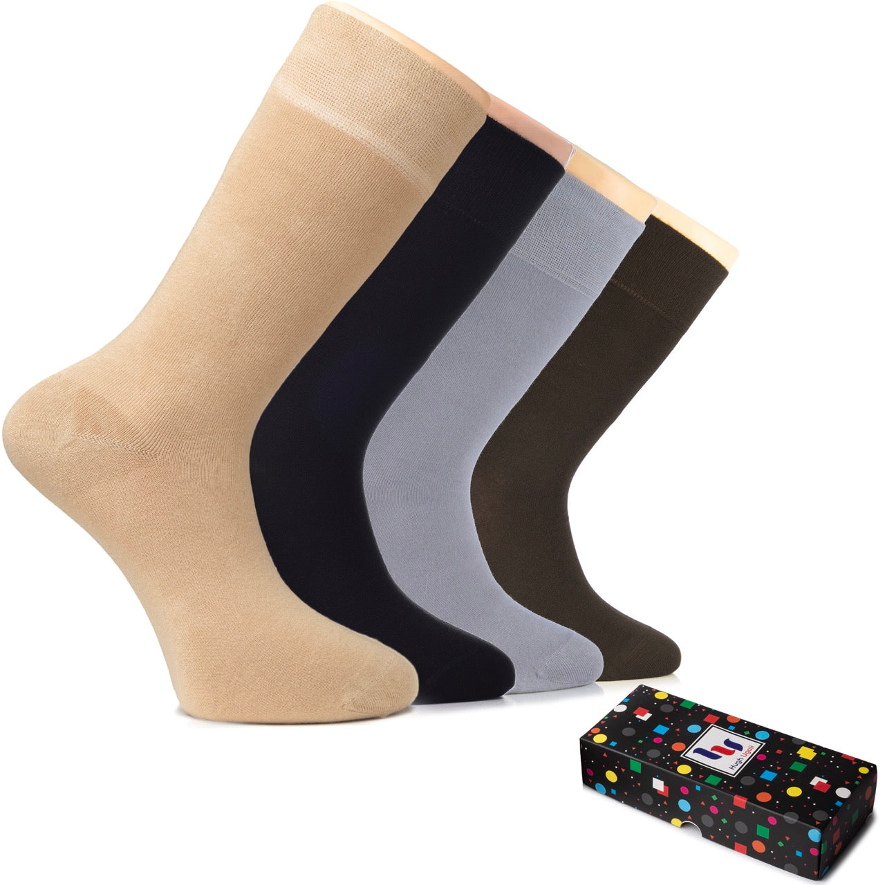 Set of four pairs of socks in beige, black, light gray, and brown with a polka dot box on a white background.