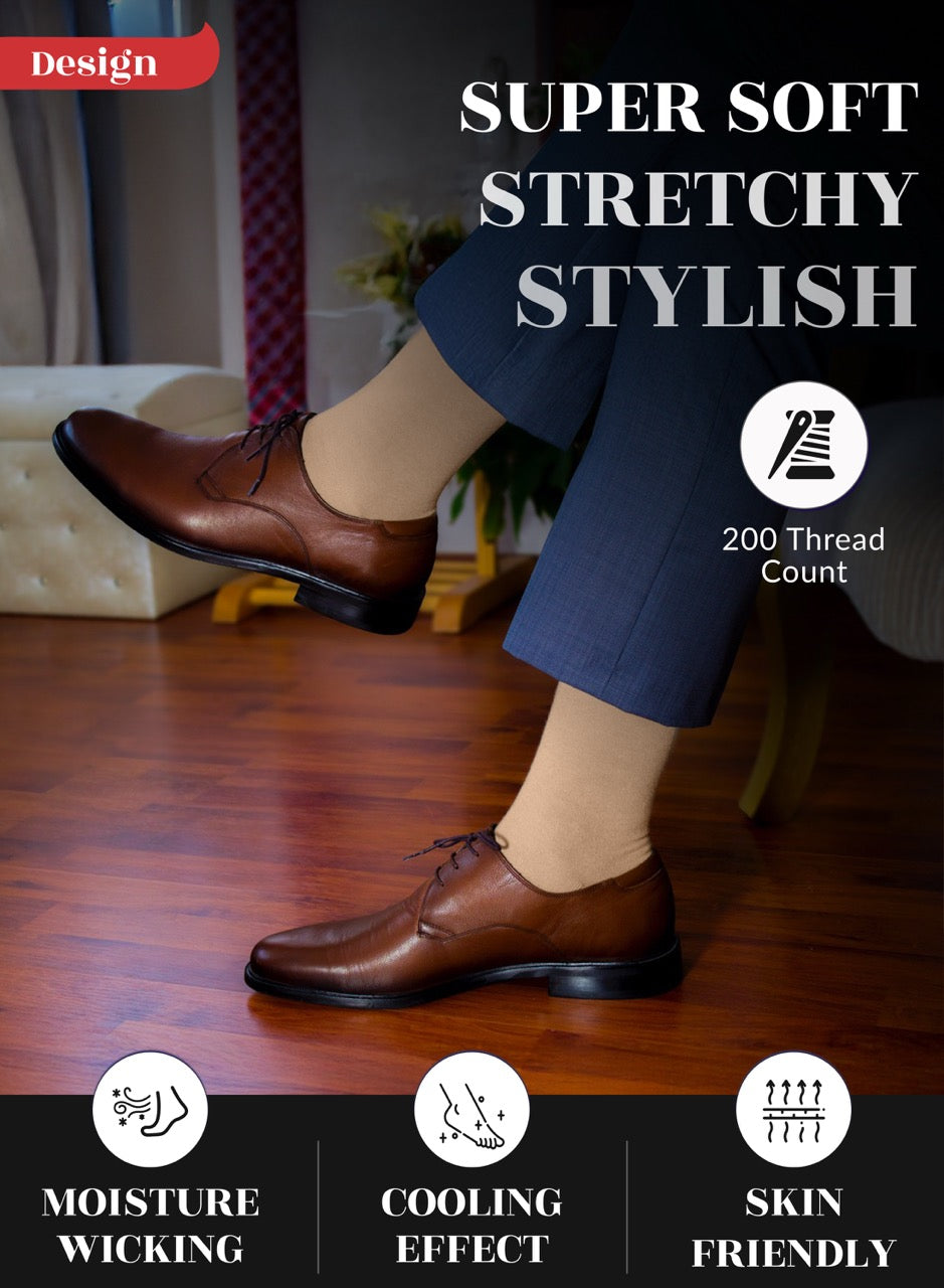 Brown dress shoes worn with blue pants  and beige socks on a wooden floor, with text highlighting shoe features.