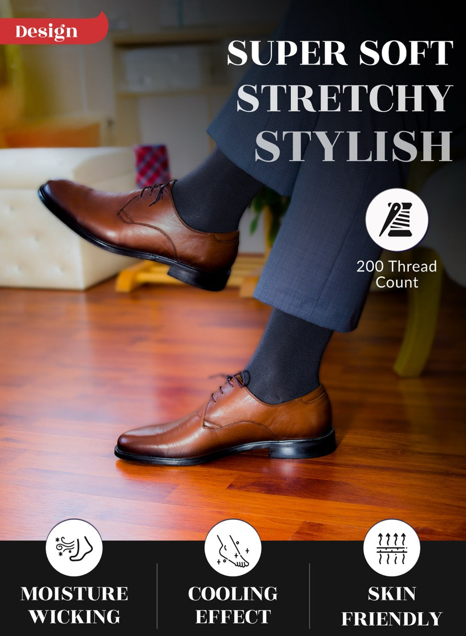 Person wearing brown dress shoes and dark dress pants and charcoal socks on a wooden floor with text highlighting features.