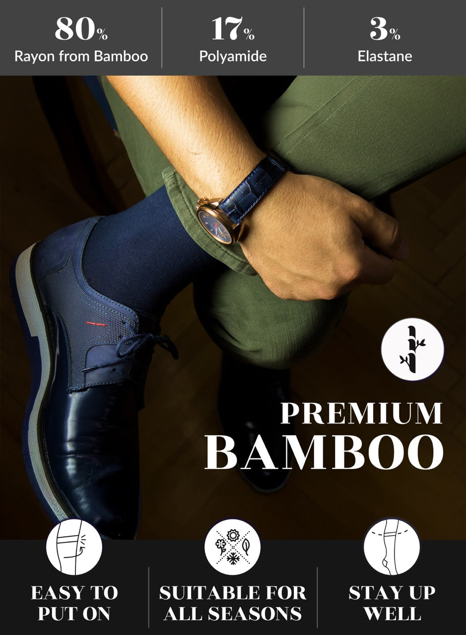 Person wearing a navy blue socks and blue shoe and green pants with text about shoe material and features.