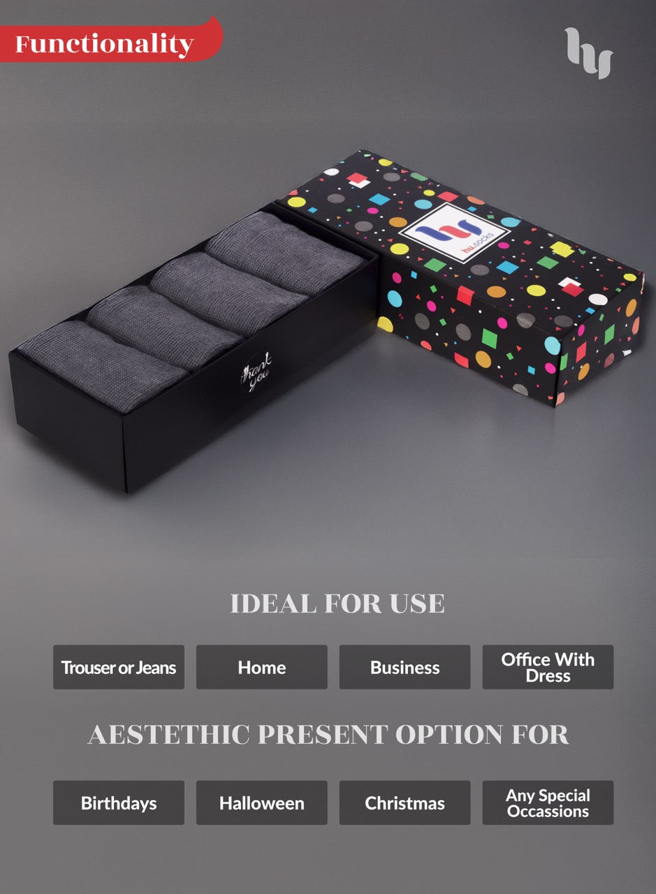 Smoke gray socks with Black box with gray interior and colorful polka dot exterior on a gray background