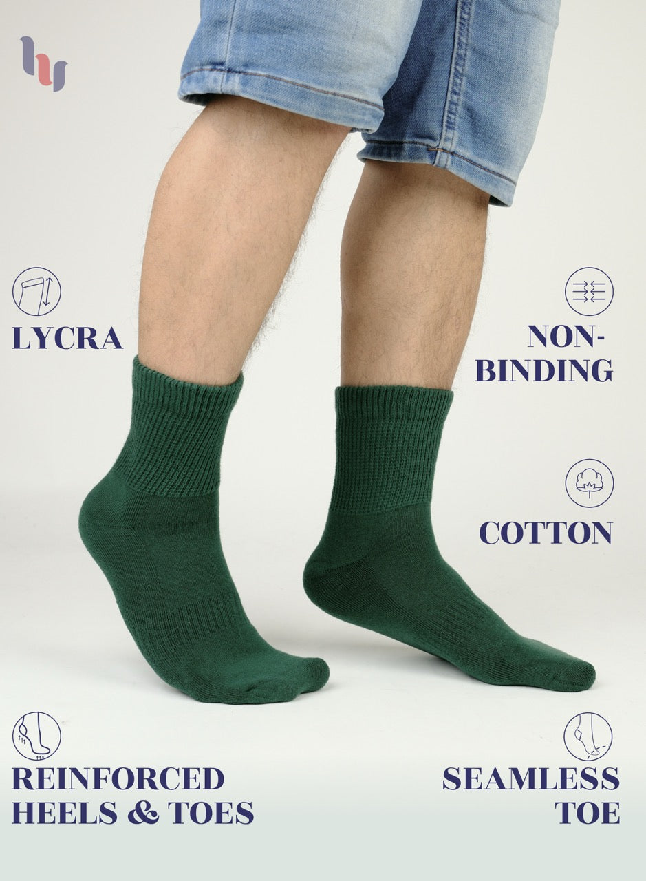 army Green socks worn with denim shorts on a white background, featuring LYCRA, non-binding, cotton, reinforced heels & toes, and seamless toe text.