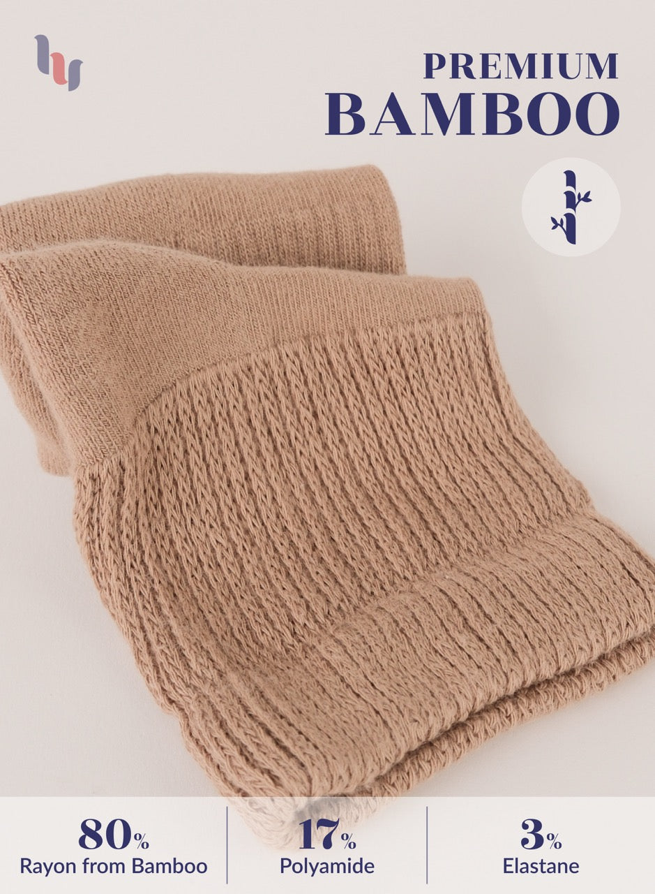 Beige knitted scarf with bamboo text and percentage details on a light background
