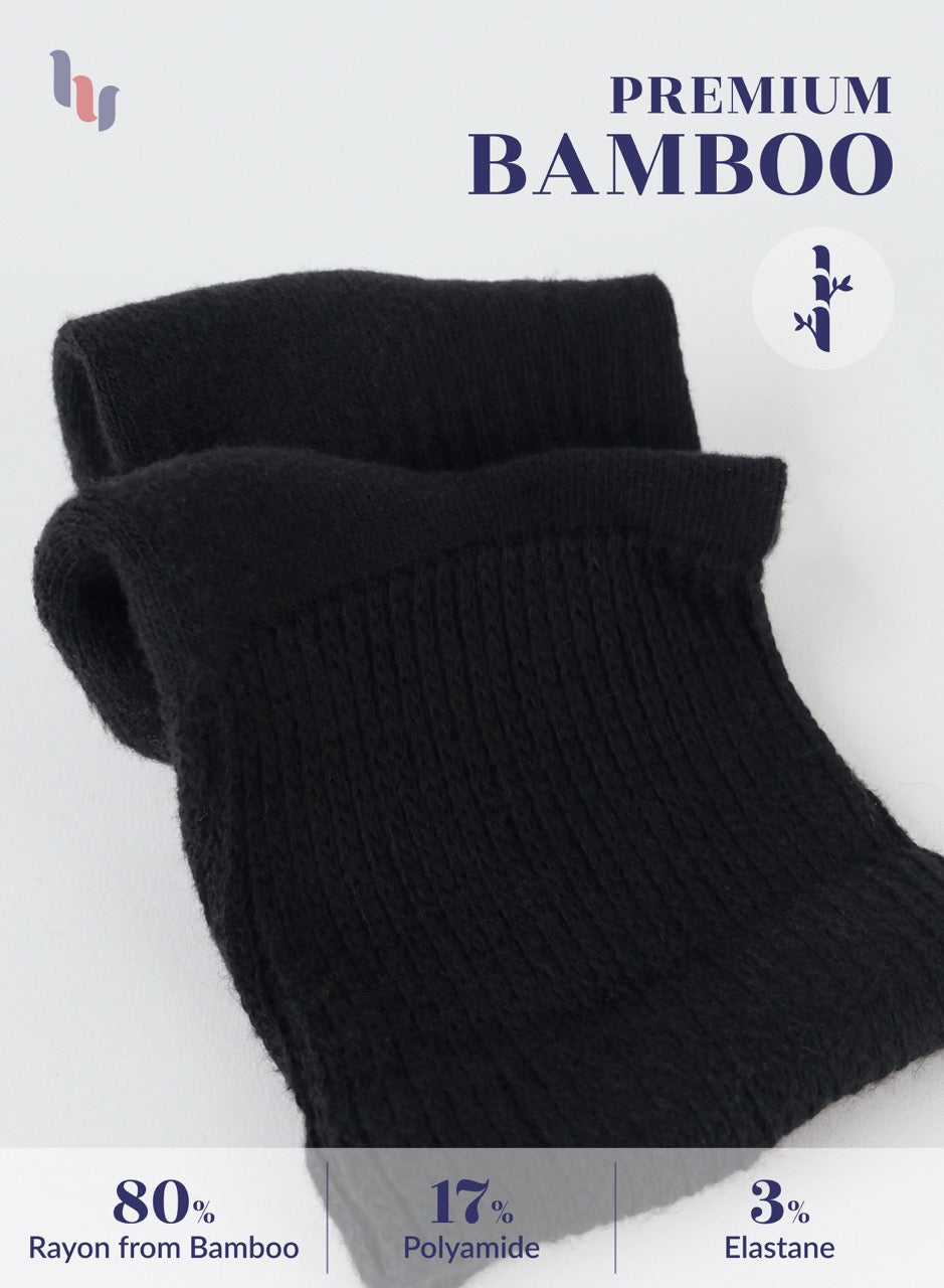 Black socks with bamboo fiber information on a white background