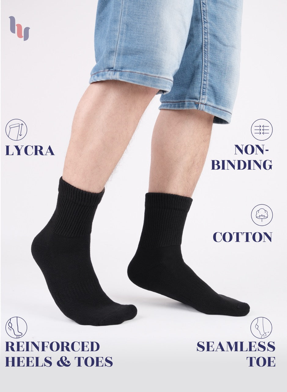 Person wearing black socks with text highlighting features on a white background