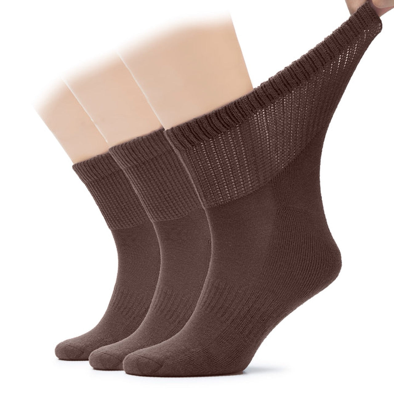 Three pairs of brown socks on a white background