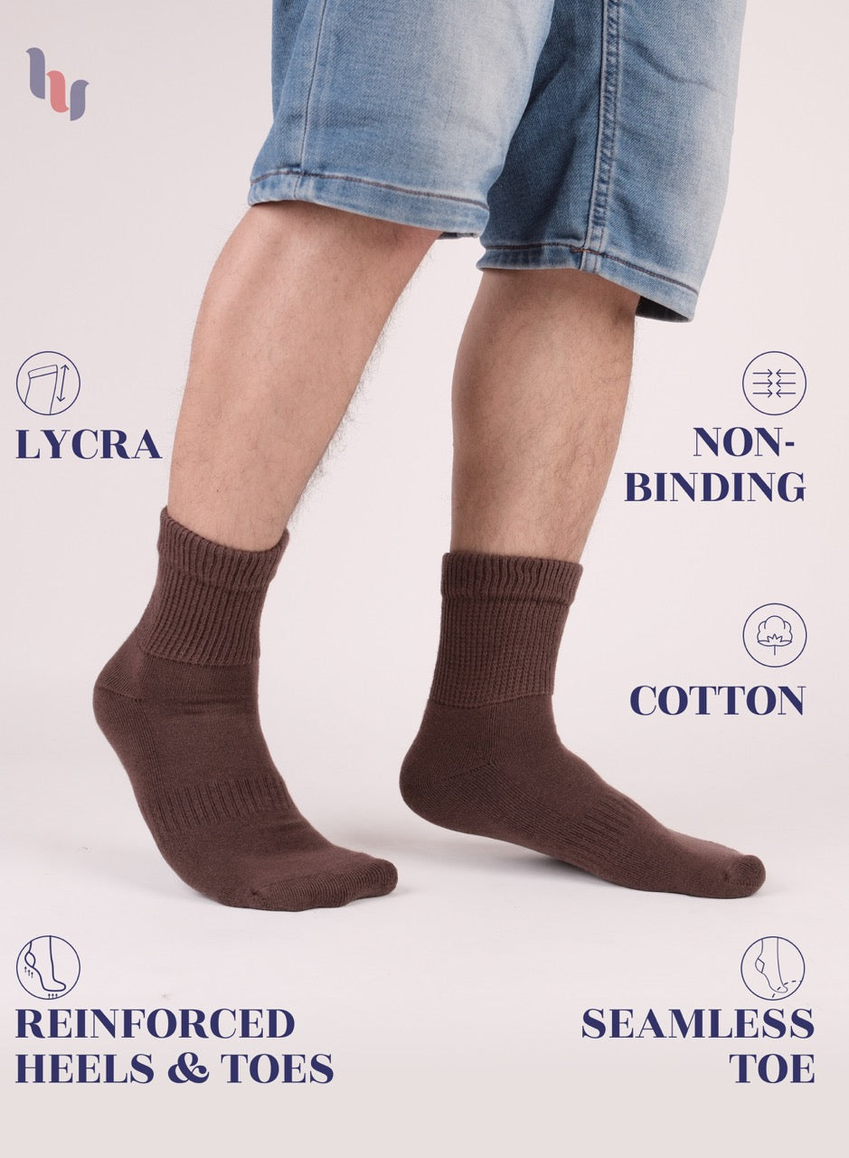 Brown socks worn with denim shorts on a white background, featuring text about sock features.