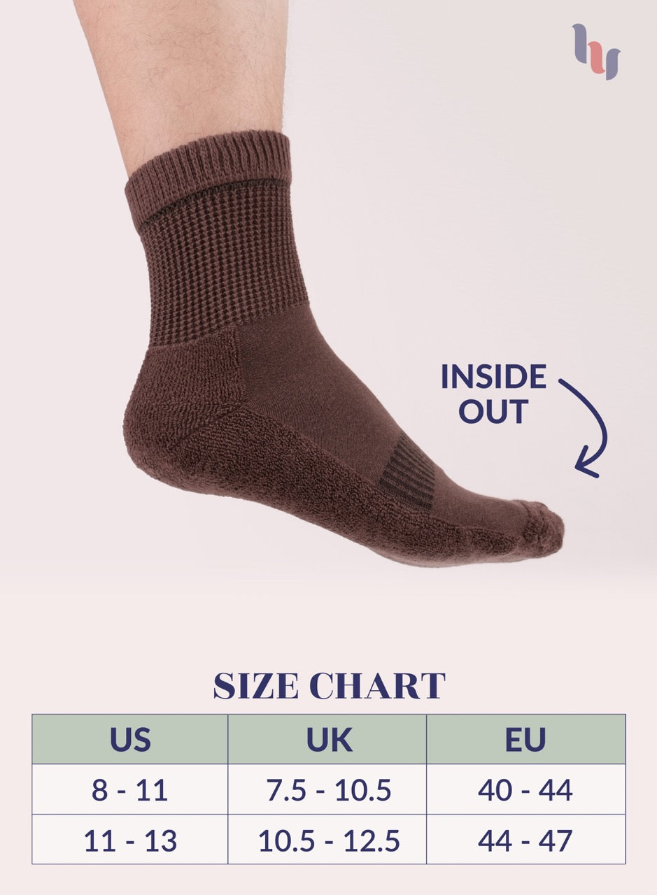 Brown sock with size chart on a light pink background