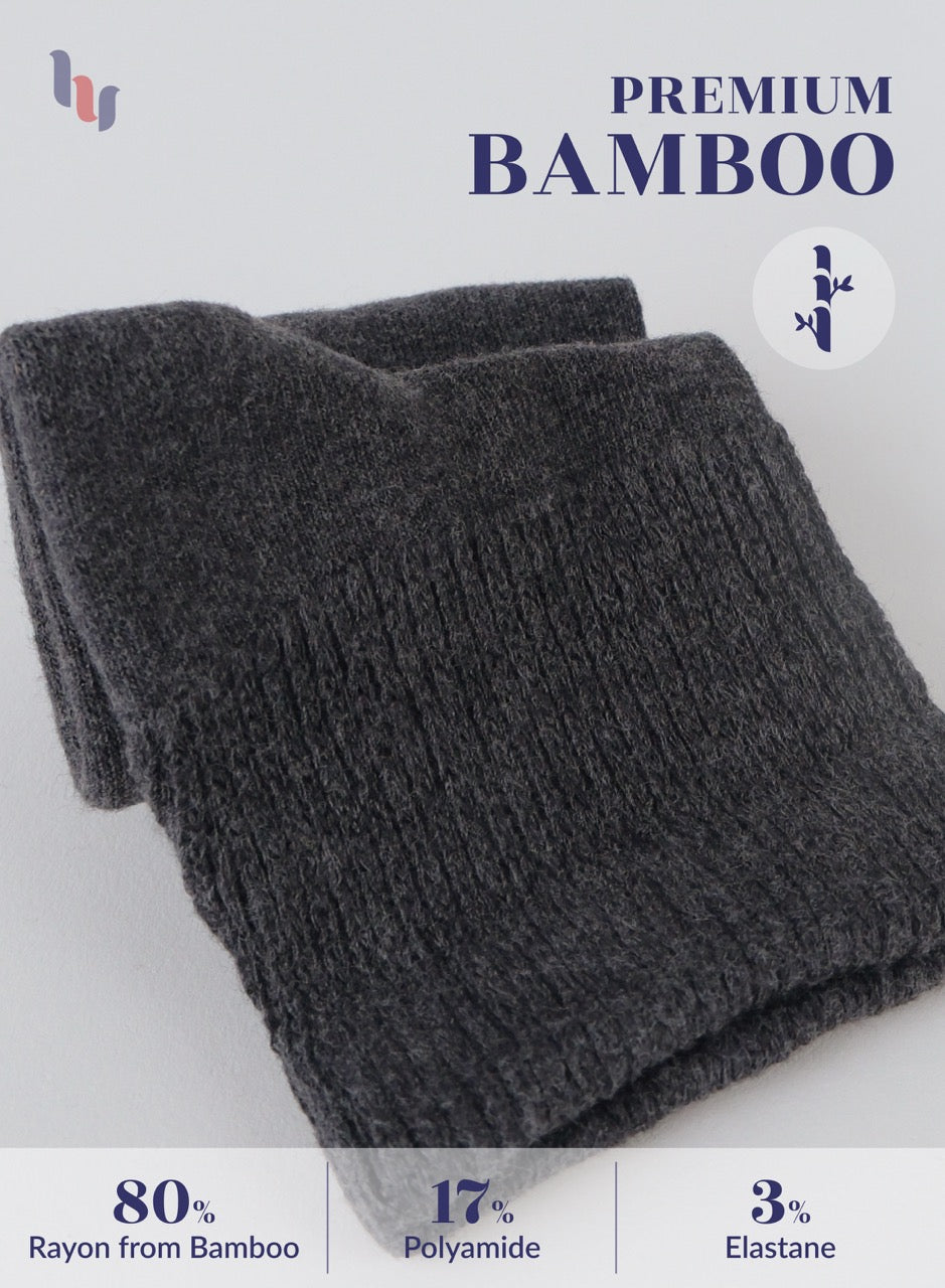 Dark gray knitted fabric with bamboo text and fiber content details on a light gray background