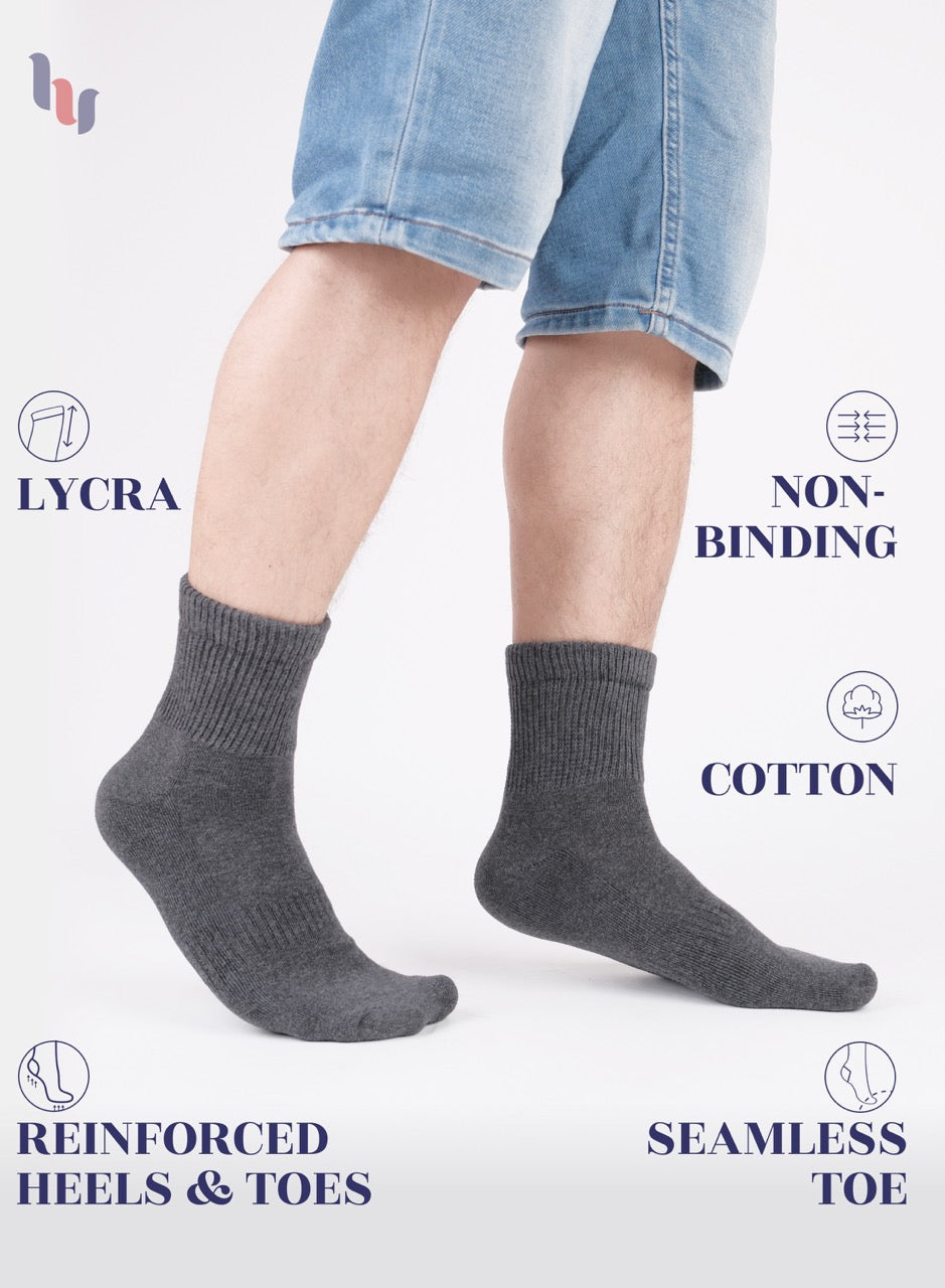 Gray socks worn with denim shorts on a white background, featuring text about sock materials and features.