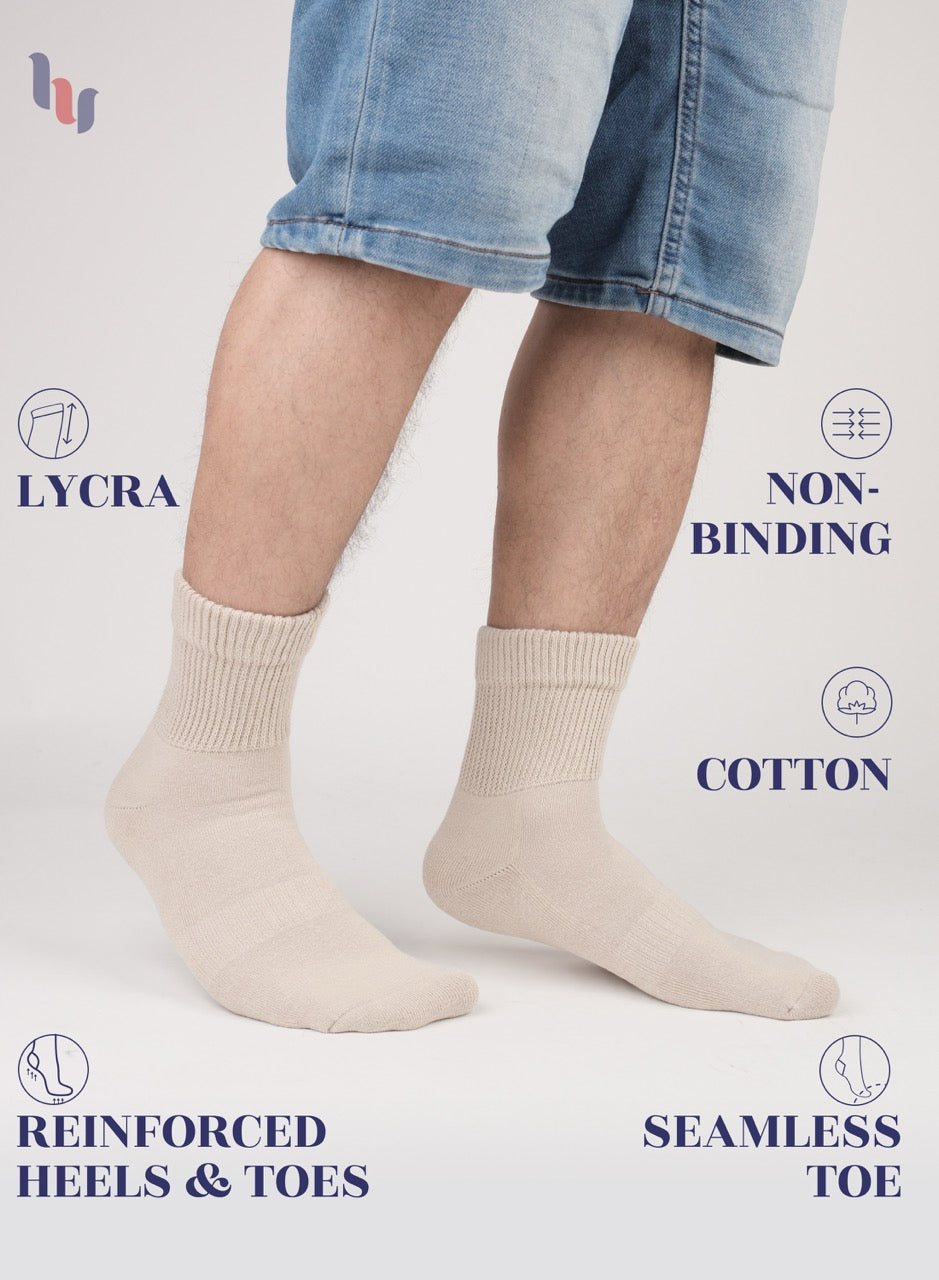 Light Beige socks worn with denim shorts on a white background, featuring LYCRA, non-binding, cotton, reinforced heels & toes, and seamless toe text.
