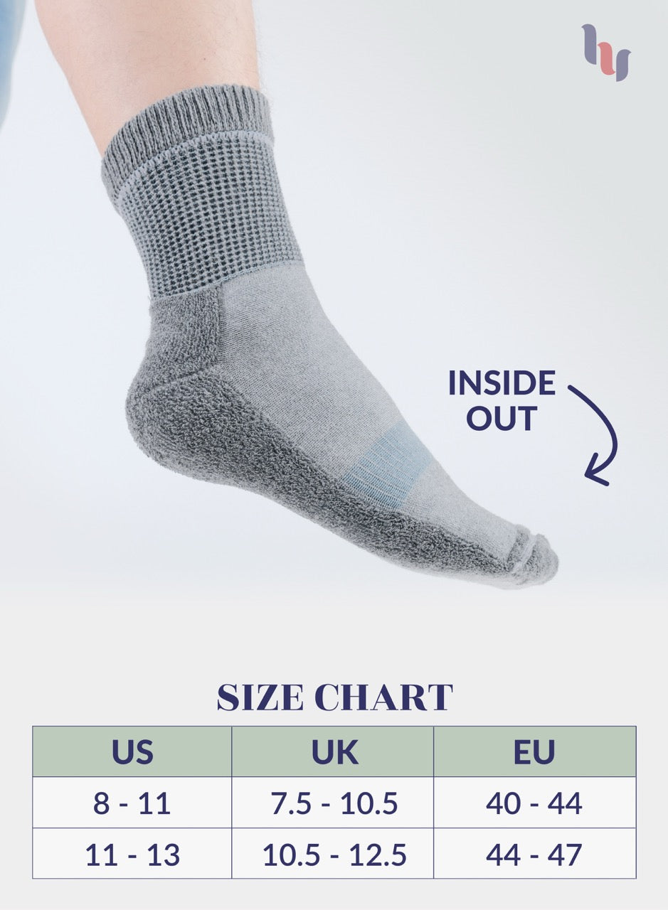 Light Gray sock on a foot with size chart below on a white background