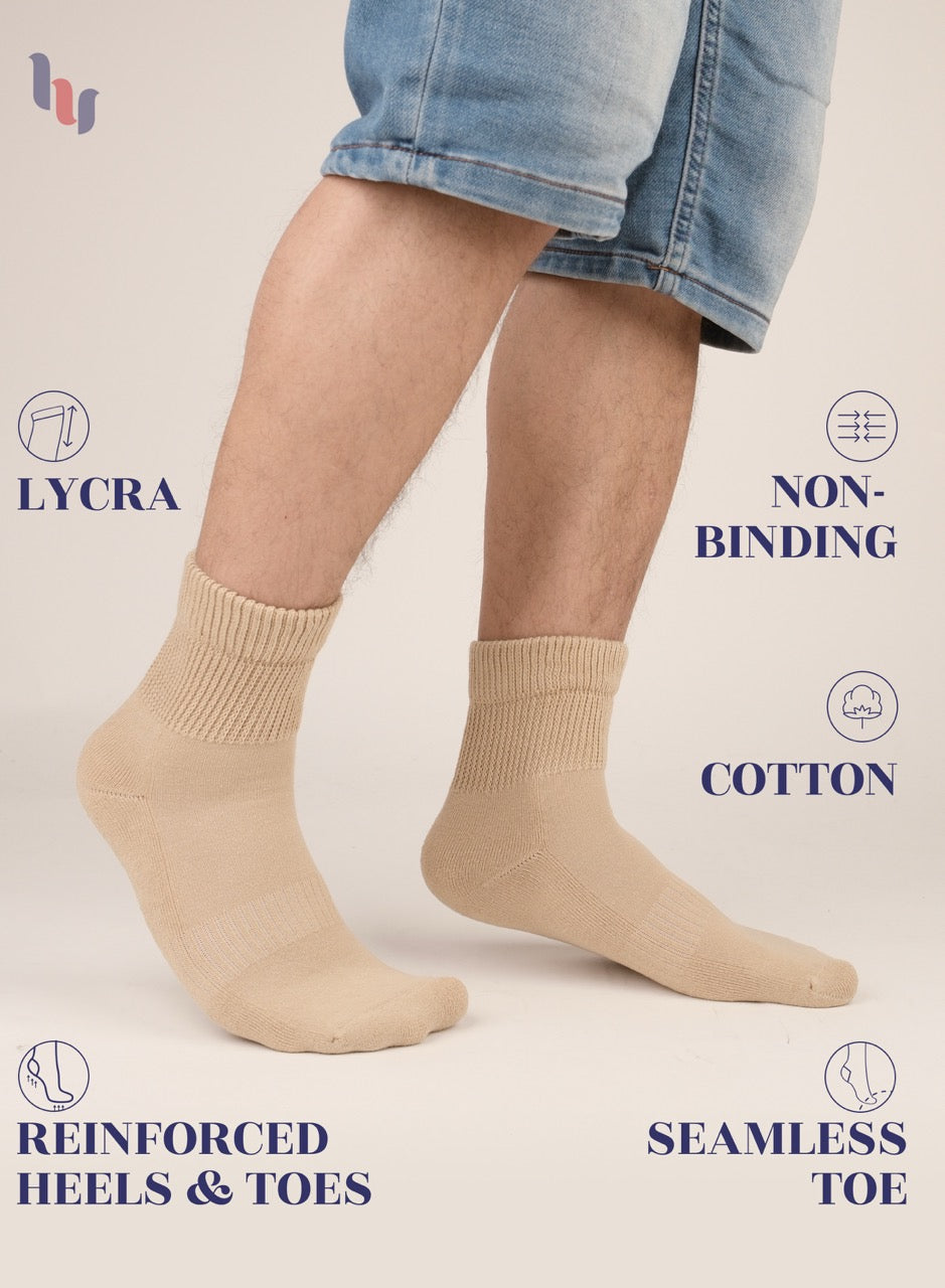 medium Beige socks worn with rolled-up jeans on a light background, featuring text on sock features.