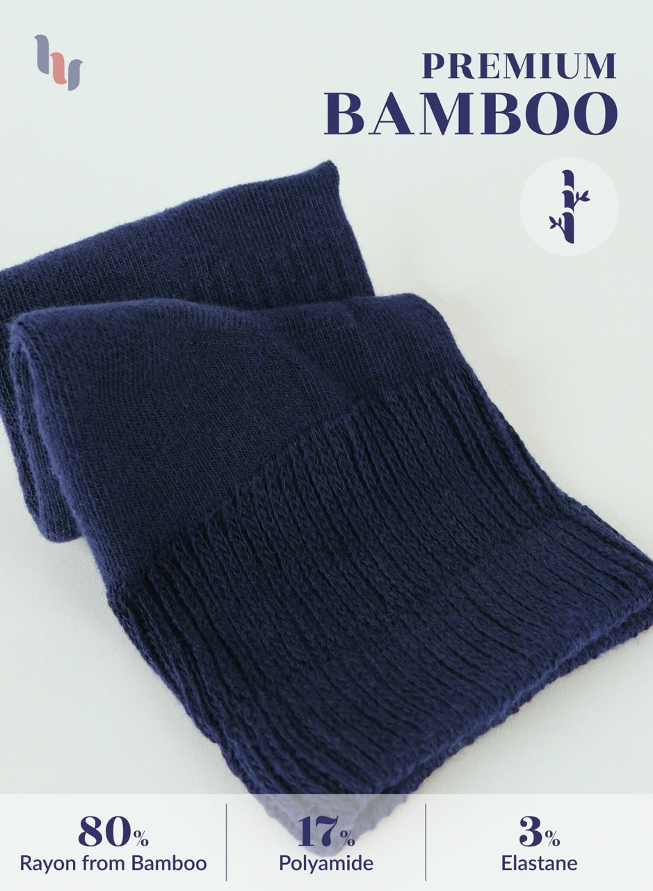 Folded navy blue scarf with bamboo text and fabric composition details on a light background