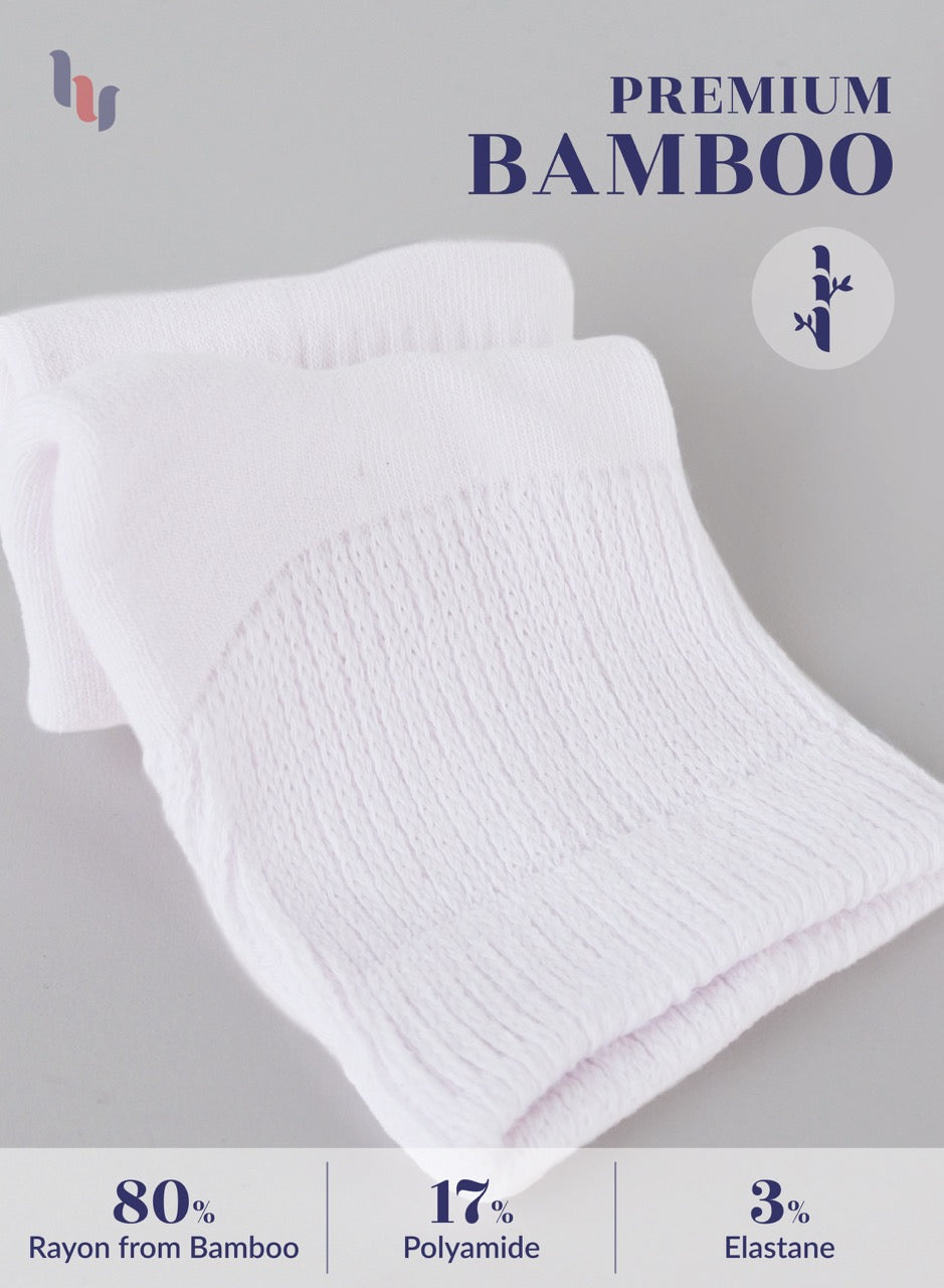 White towel with bamboo text and fabric composition details on a gray background