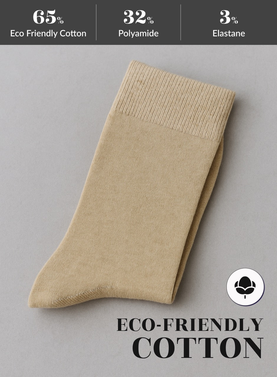 Beige sock with eco-friendly cotton label on a gray background