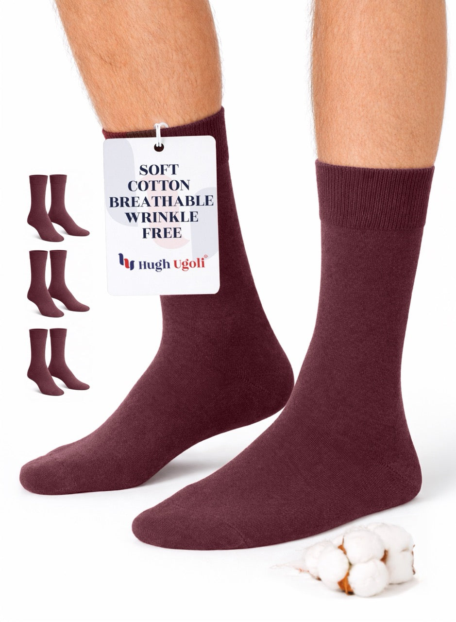 Burgundy socks with a tag on a white background