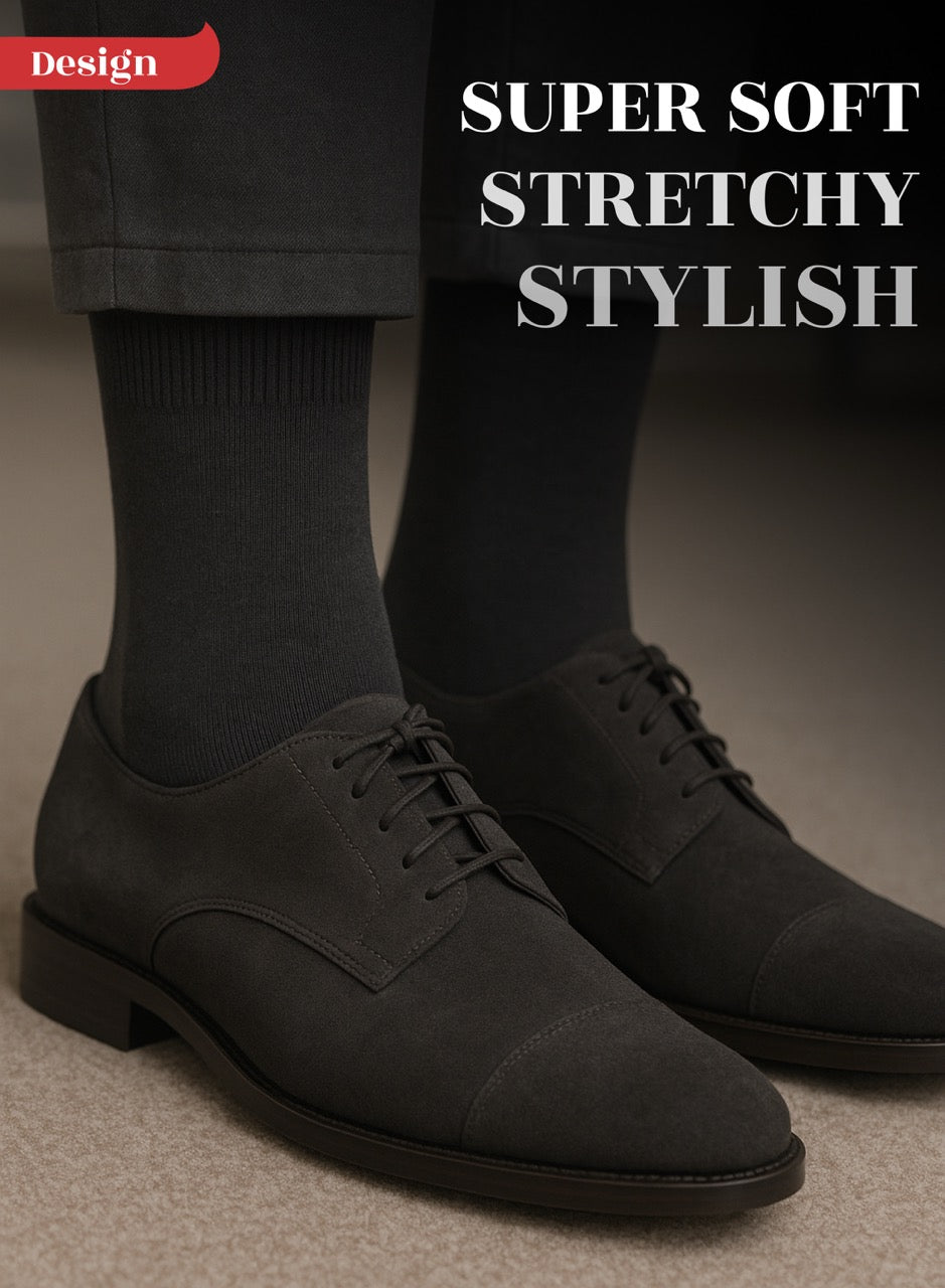 Black dress shoes with Charcoal socks on a neutral background, featuring text 'Super Soft, Stretchy, Stylish'.