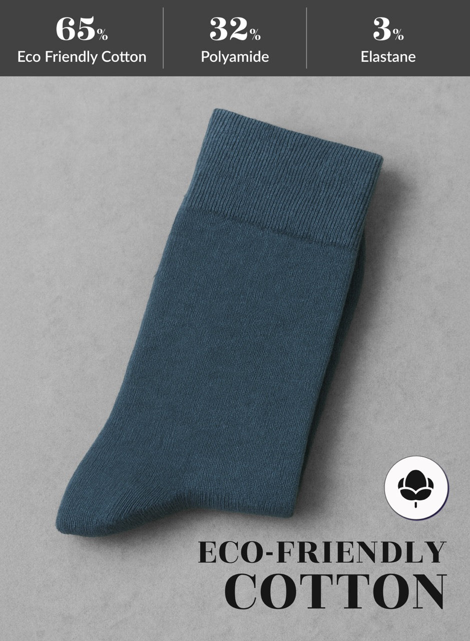 Indigo sock on a gray background with eco-friendly cotton label