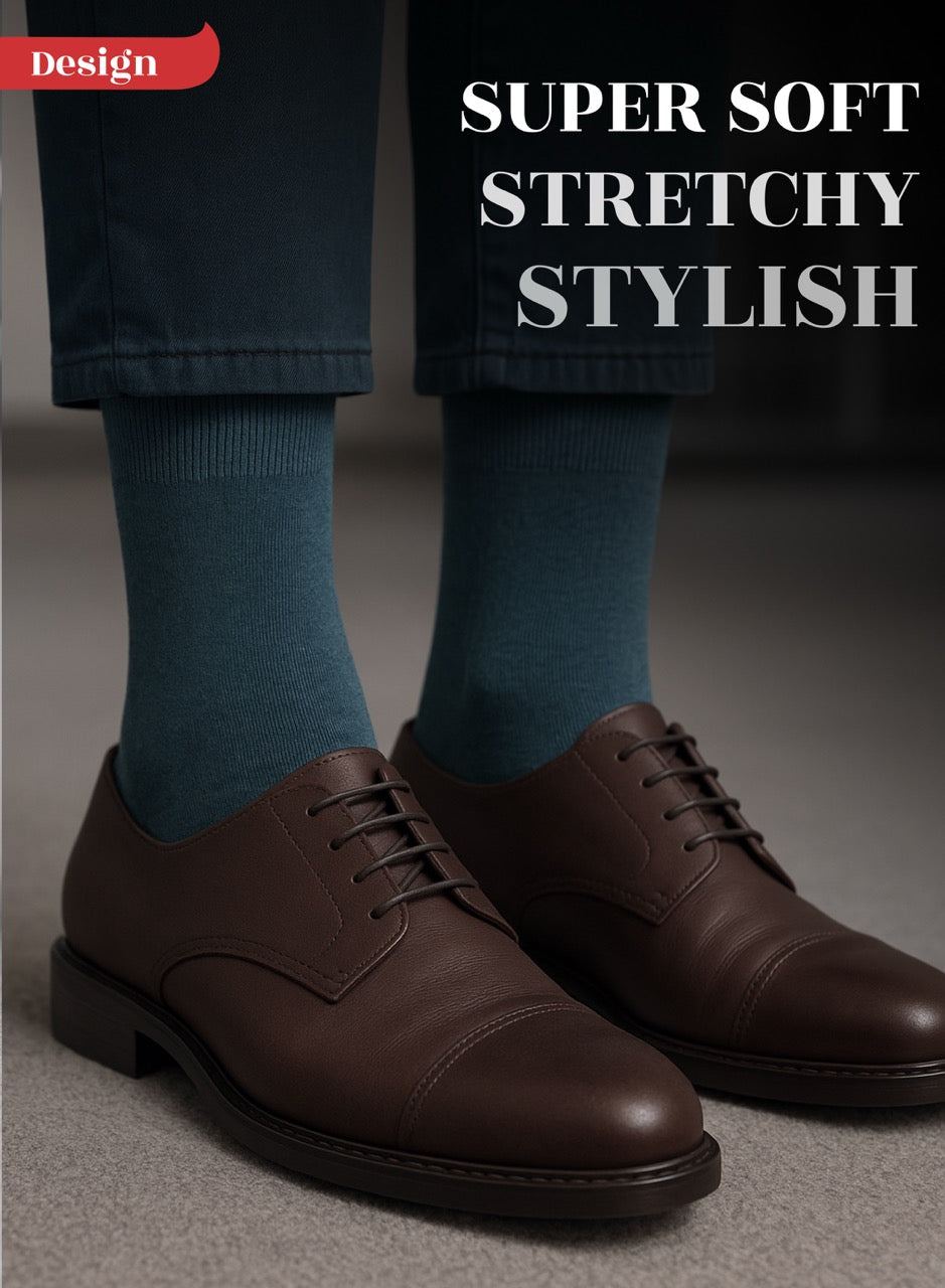 Indigo socks with brown dress shoes on a neutral background