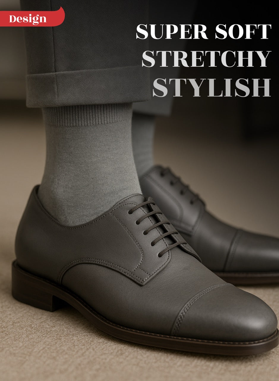 Gray dress shoes with Light Gray socks on a neutral background, text 'Super Soft Stretchy Stylish' above.