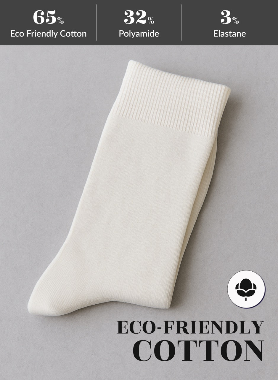 White sock on a gray background with eco-friendly cotton label