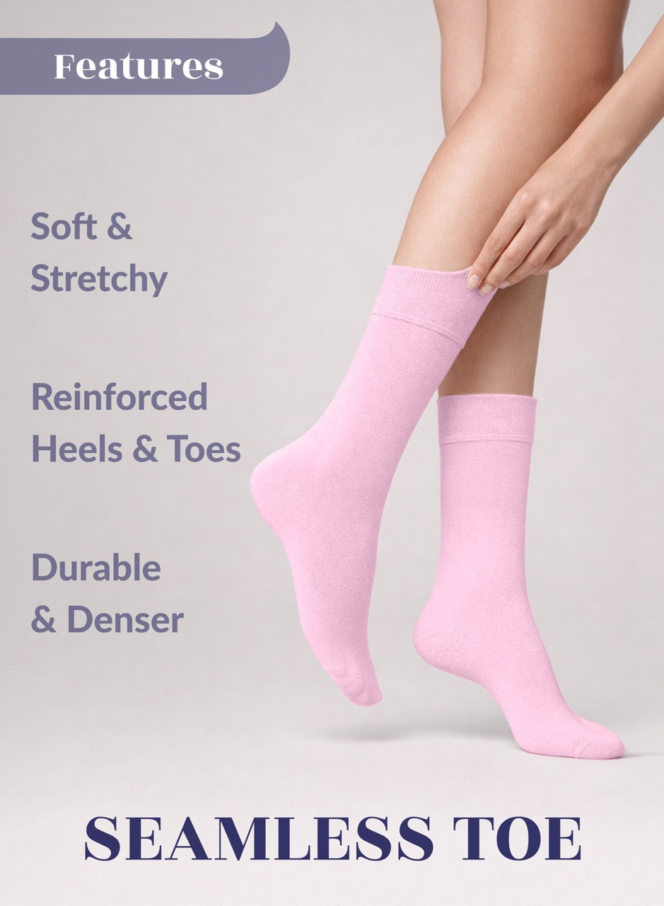 Pink socks with text highlighting features on a light gray background