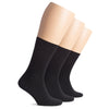 Three pairs of black socks on beige mannequin feet against a white background