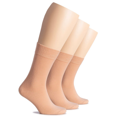 Three pairs of salmon socks on a white background