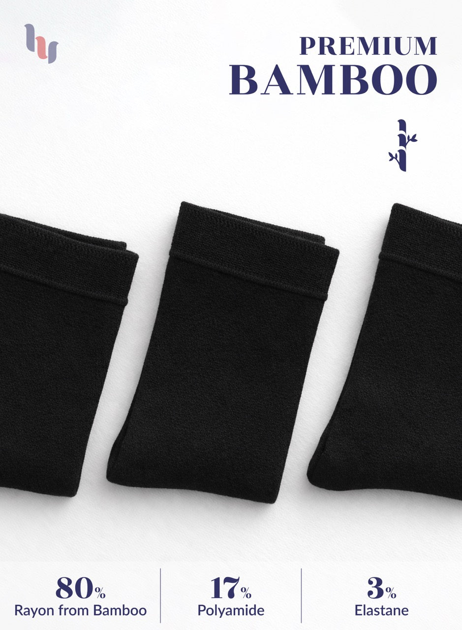Three pairs of black bamboo socks on a white background with product details.